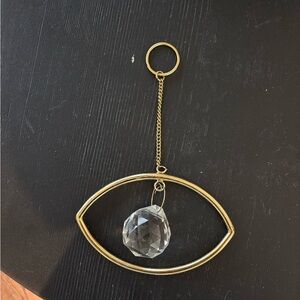 Gold Eye Shaped Wall Hanging with Crystal Pendant